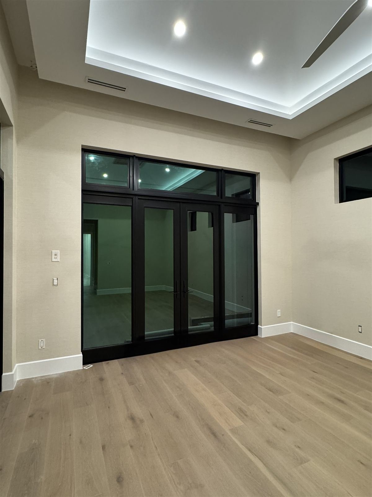 Private residence, Miami — hallway with grasscloth wallcovering
