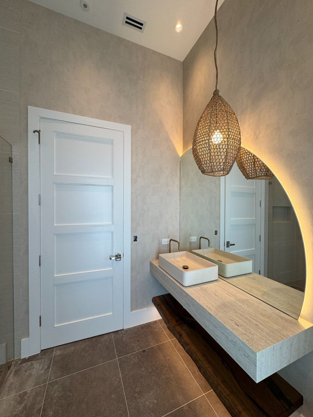 Textured wallcovering in a primary bathroom