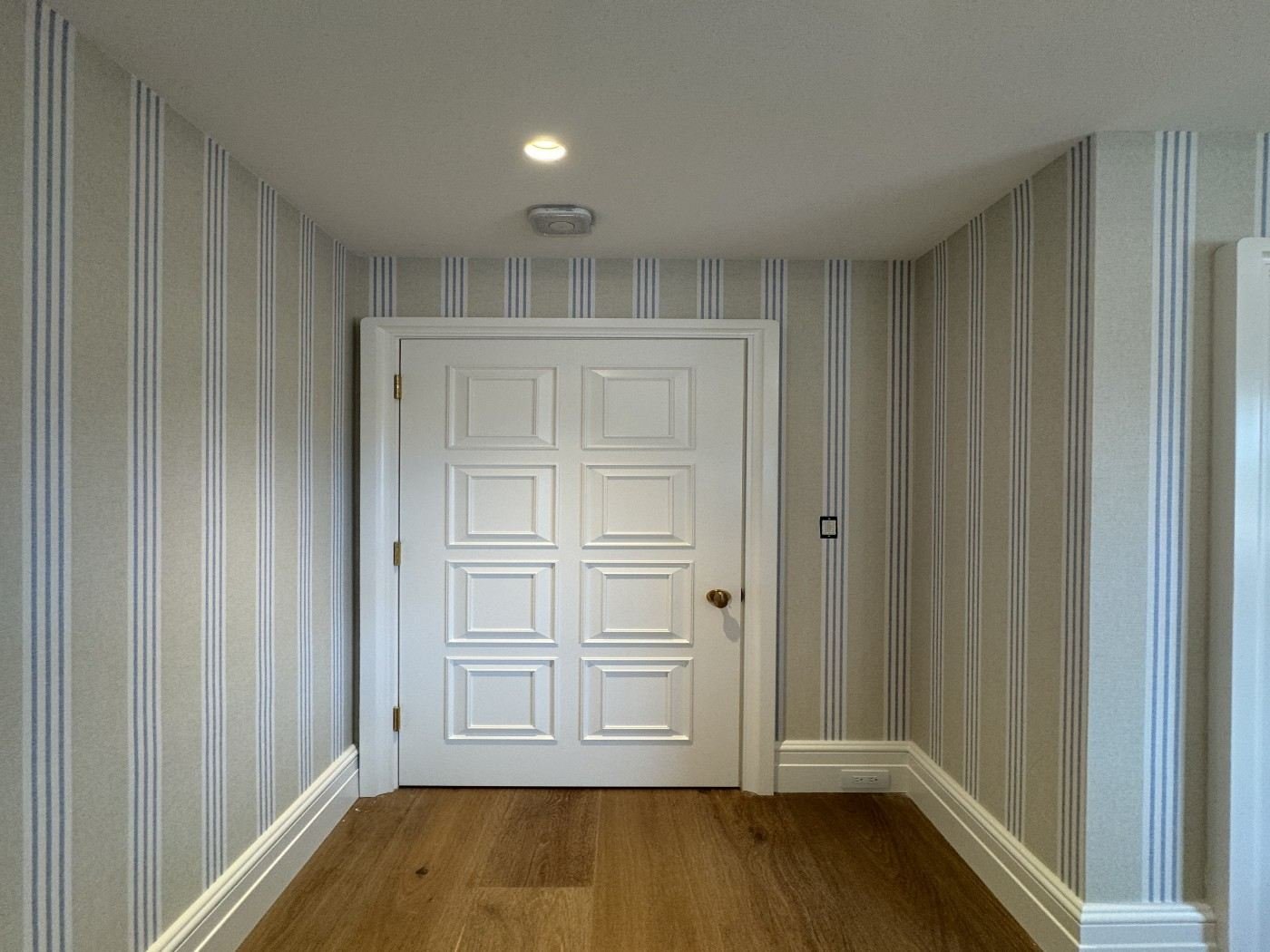 Striped wallcovering in a hallway